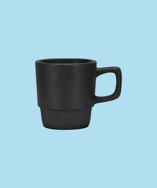Black Barista Stackable Coffee Mug on a light blue background.