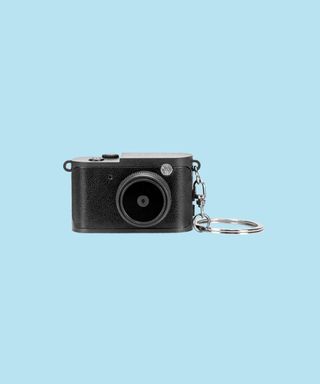 Black Candid Mini Camera shown from the front with keyring.