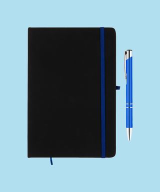 Everyday Notebook and Pen set - Dark Blue. Matching dark blue pen and notebook trim on light blue background, 72 percent fit.