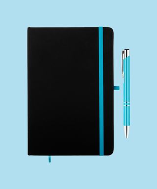Everyday Notebook and Pen set - Light Blue. Matching pen and notebook trim on light blue background, 72 percent fit.