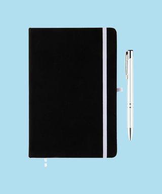Everyday Notebook and Pen set - White. Matching pen and notebook trim on light blue background, 72 percent fit.