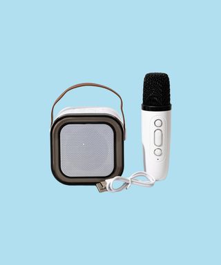 Caroline portable karaoke machine with microphone.
