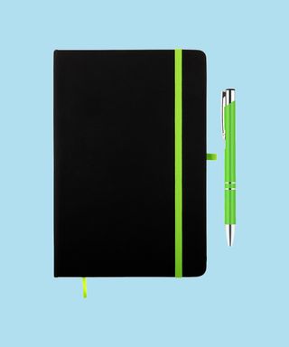 Everyday Notebook and Pen set - Light Green. Matching pen and notebook trim on light blue background, 72 percent fit.